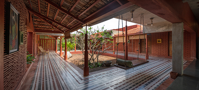 https://www.designboom.com/wp-content/dbsub/454621/2023-07-08/this-weekend-home-near-chennai-is-steeped-in-reinterpreted-vernacular-nalukettu-architecture-6-64a996074f16e.jpg