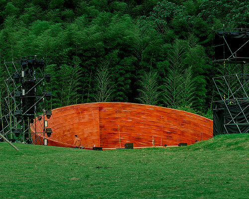 SODA architects plants bamboo stage installation amid mountains for qingshan art season