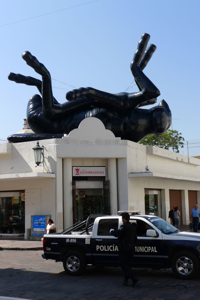 florentijn hofman's giant dead fly looks over the ...