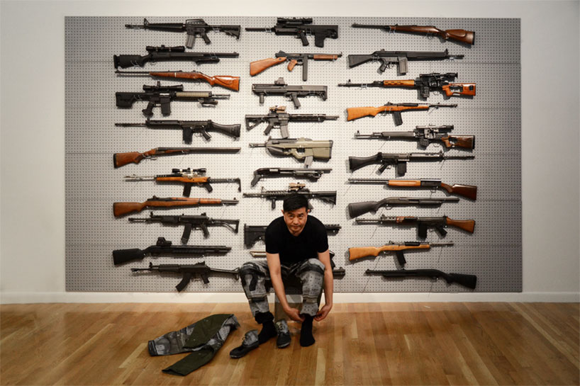 liu bolin: gun rack performance at eli klein fine art