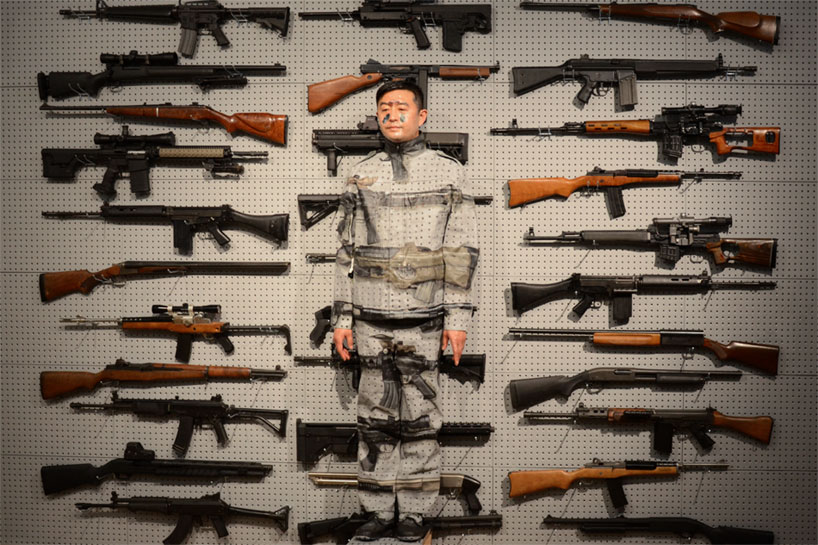 liu bolin: gun rack performance at eli klein fine art