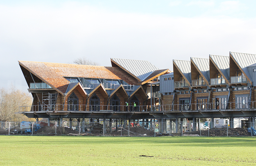 fram build mimics upturned viking boat in riverside clubhouse