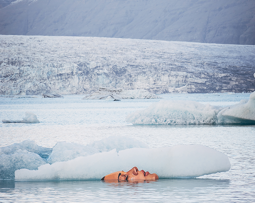 artist warns of climate change with painted murals on melting icebergs