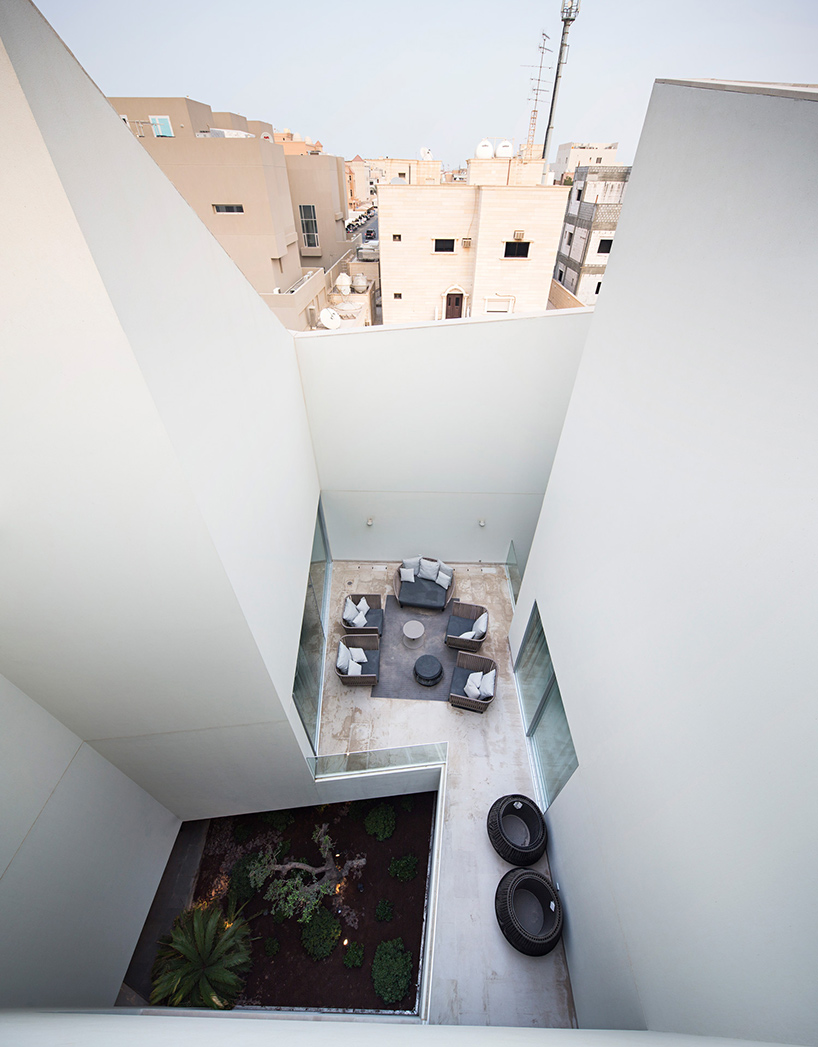 AGi architects hides wall  house in kuwait  behind stone fa ade