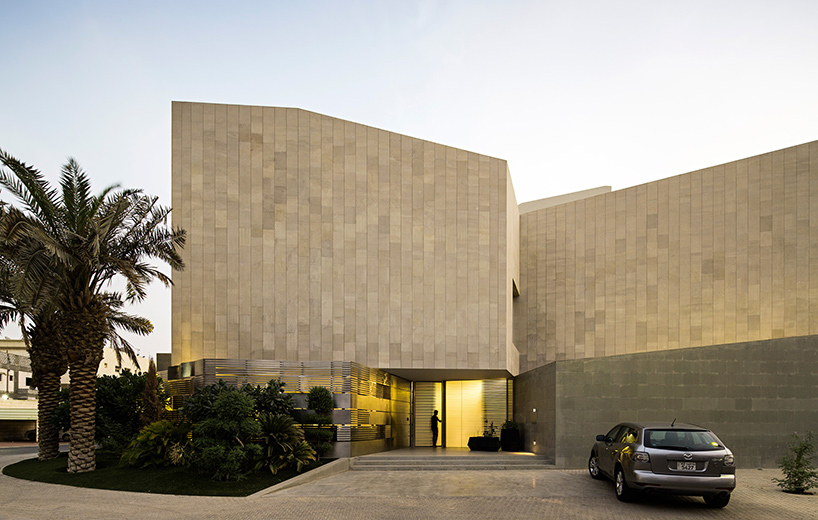 AGi architects hides wall  house in kuwait  behind stone fa ade