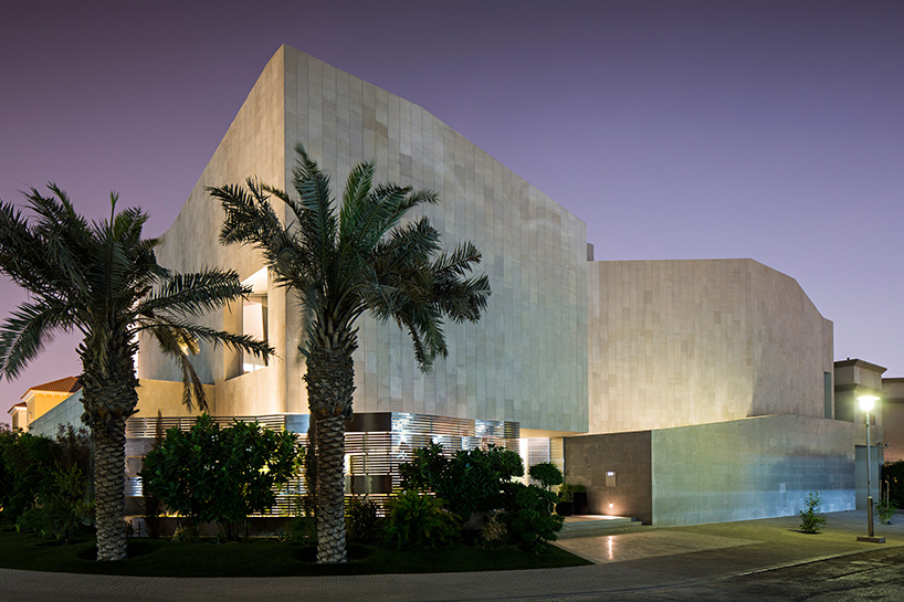 AGi architects hides wall  house in kuwait  behind stone fa ade