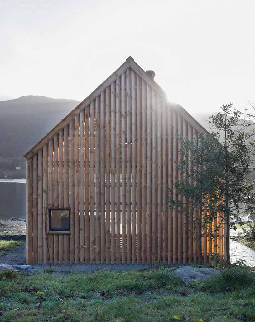 kolab and koreo architects revitalizes timber boathouse in