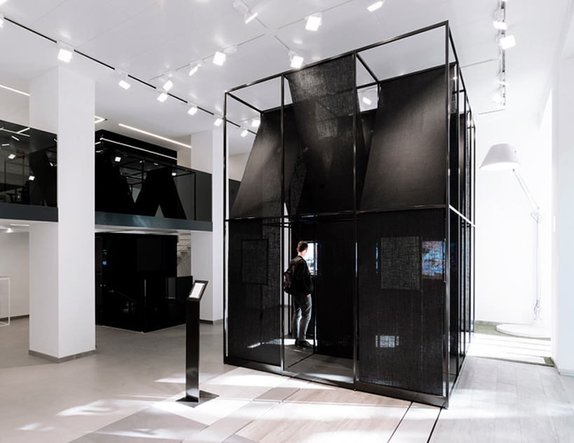 SET architects wraps steel-framed installation with black cloth