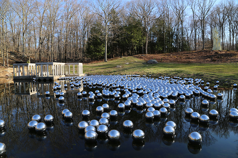 yayoi kusama floats a landscape of 1,300 mirrored spheres at the glass ...