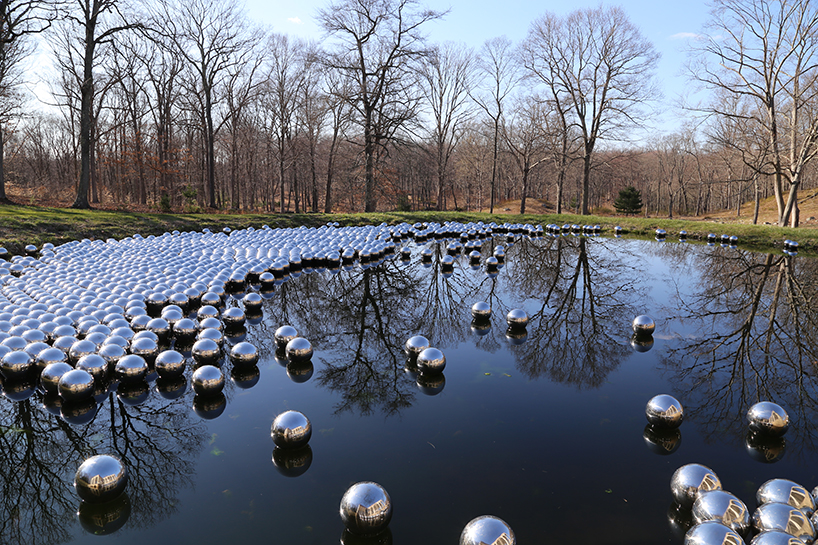 yayoi kusama floats a landscape of 1,300 mirrored spheres at the glass ...