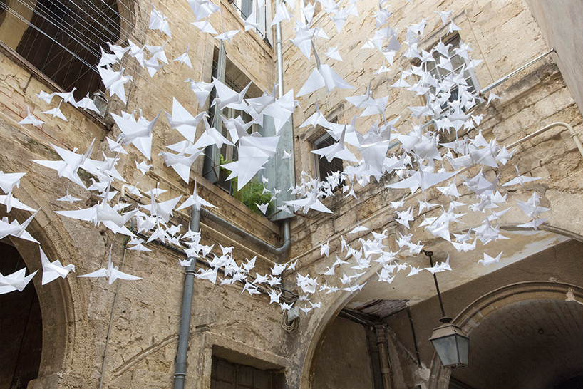 flock of origami birds at the festival des architectures vives