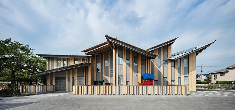 kengo kuma tops kindergarten in japan with multiple