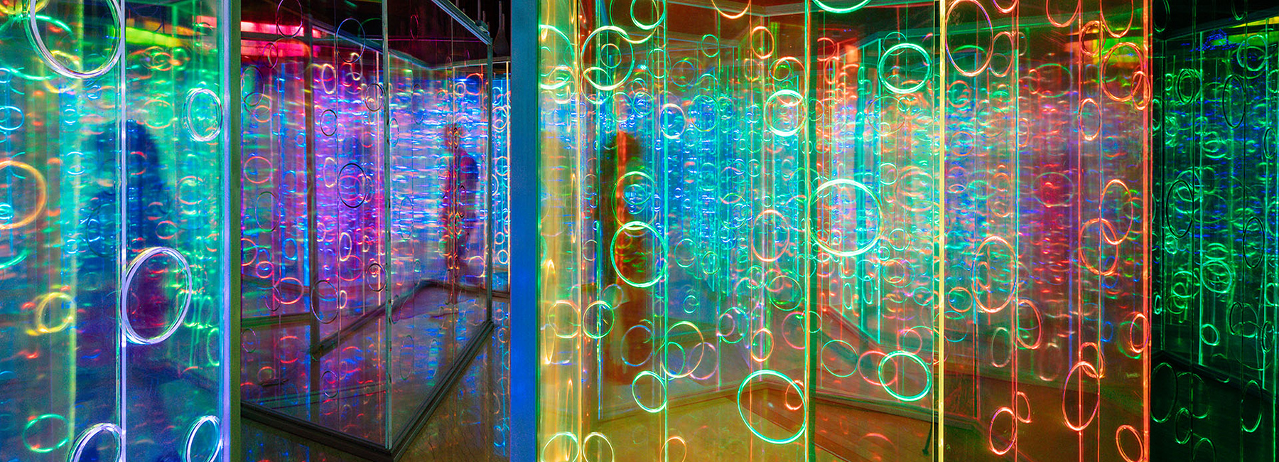 rainbow-hued light labyrinth by brut deluxe forms an immersive infinity ...