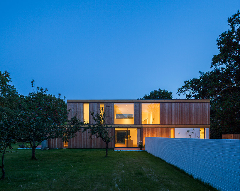 str m architects builds timber framed woodpeckers house