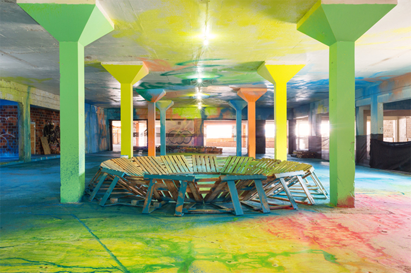 sofia maldonado envelops a derelict factory in waves of color