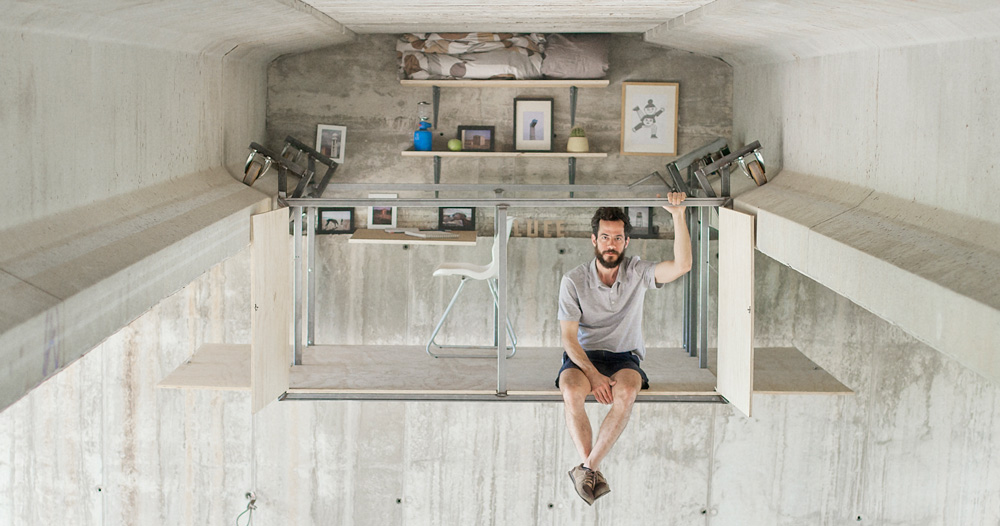 fernando abellanas suspends secret studio beneath a busy 