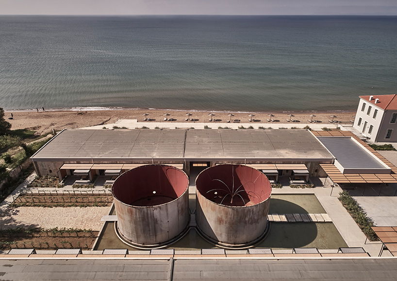 k-studio transforms derelict wine factory into hotel on the coast of greece