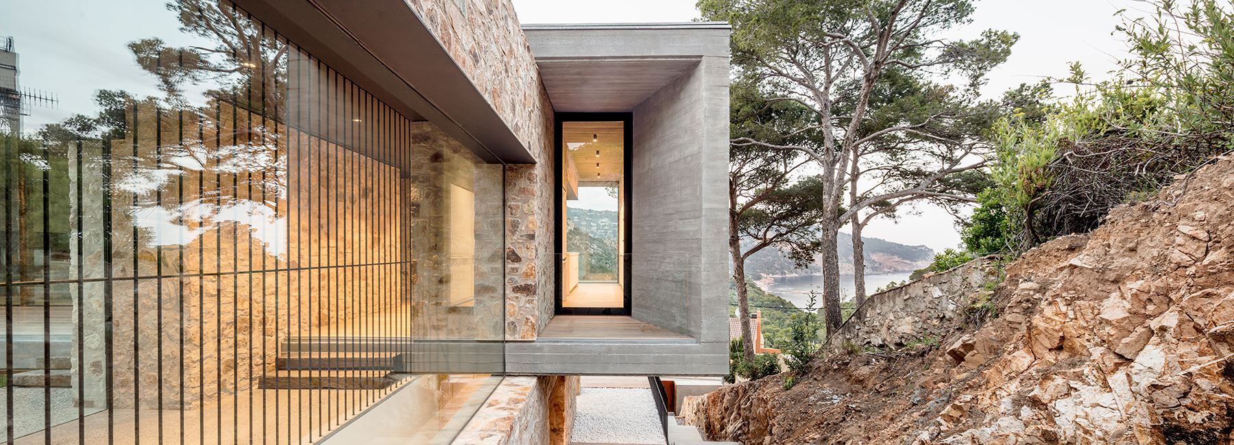 casa 1510 by nordest arquitectura emerges from the landscape of spain