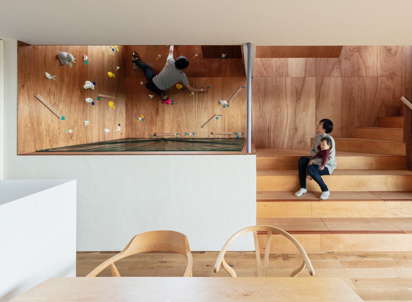 the bouldering room is placed in the center of the house, surrounded by ...