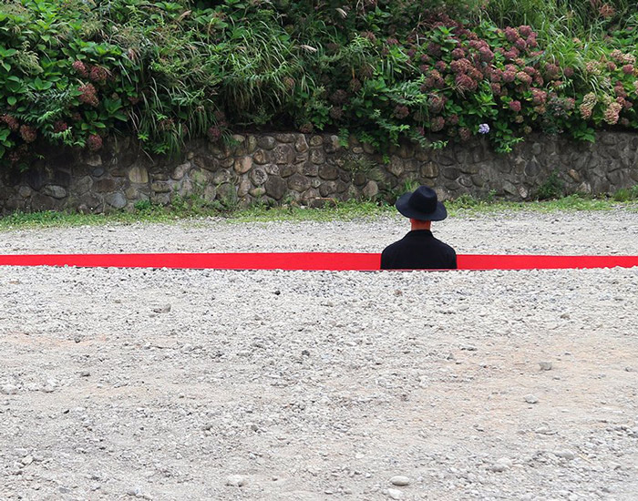 a red wound cuts the earth for hajime yoshida + yoshihiro mikami's land art in japan