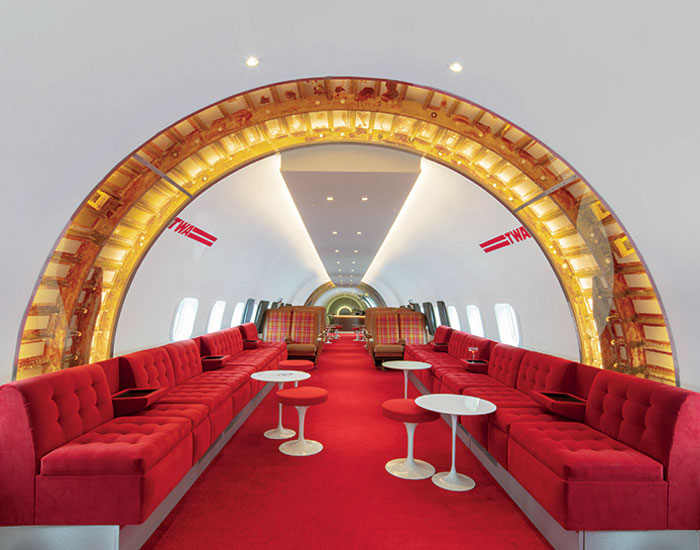 the interior design restores many of the plane's original elements such ...