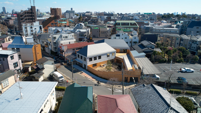 Naf Architect Design Encloses Small Pond Nursery School In Tokyo With Curved Wood Facade