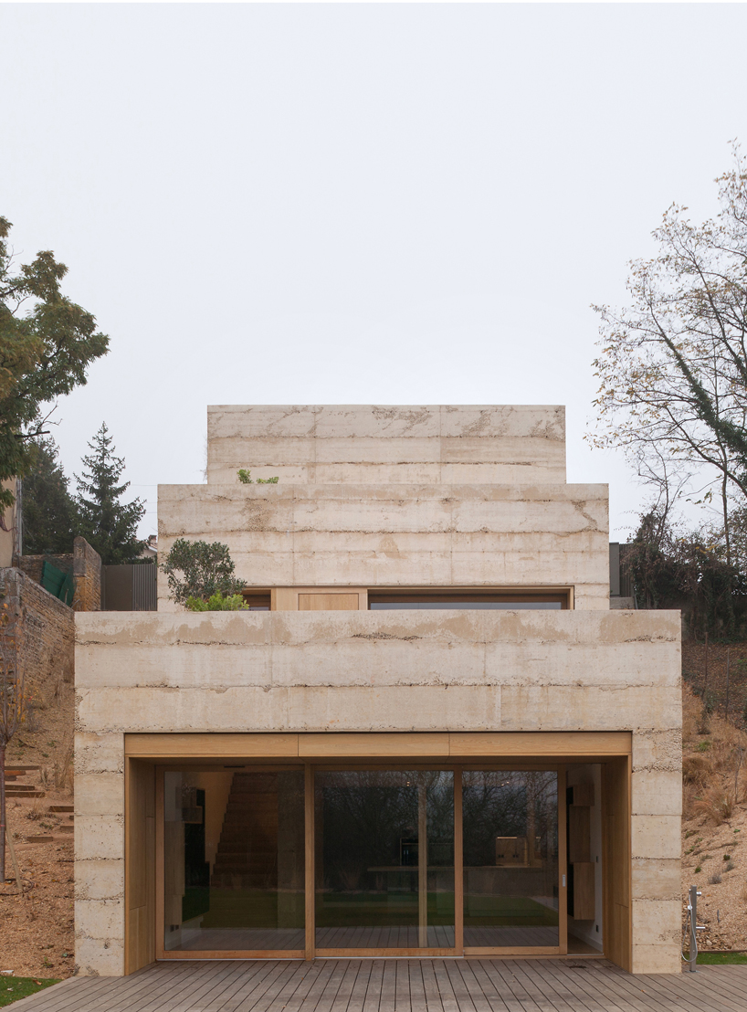 tectoniques architectes builds the P. house from ochre concrete in france