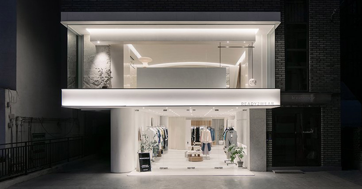 labotory contrasts rough rocks with sophisticated clothes in seoul showroom