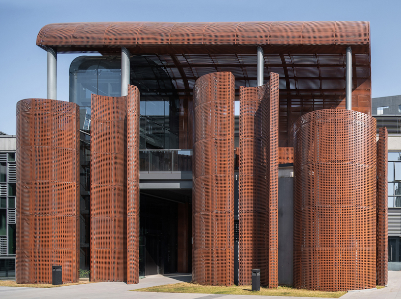 tanghua architects adds rusty red arcade to shenzhen's 