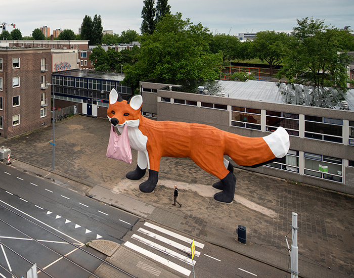 Gripping A Plastic Bag In Its Jaws, The 16-meter-long Fox Towers Over A ...