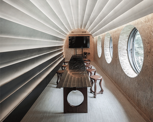 stone plates and round windows complete exhibition hall + teahouse in shanghai