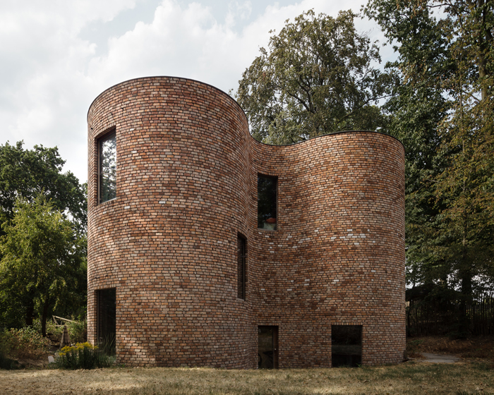 recycled bricks shape this curved house in belgium designed by BLAF architects