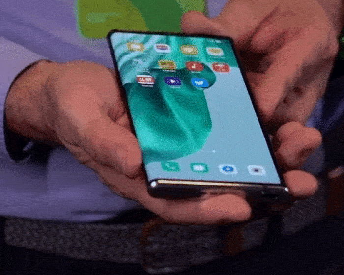 the OPPO X 2021 smartphone has a screen that doesn't fold but bends and  rolls smoothly