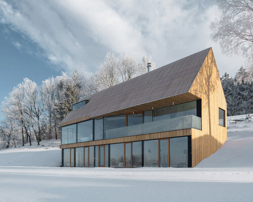 fránek architects embeds a timber-clad house into snowy czech mountains