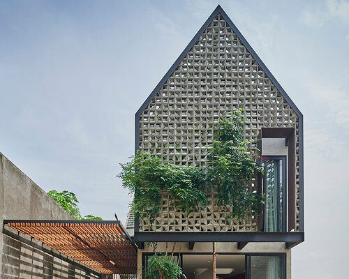 tamara wibowo tops residence in indonesia with A-shaped volume, covered with breeze blocks