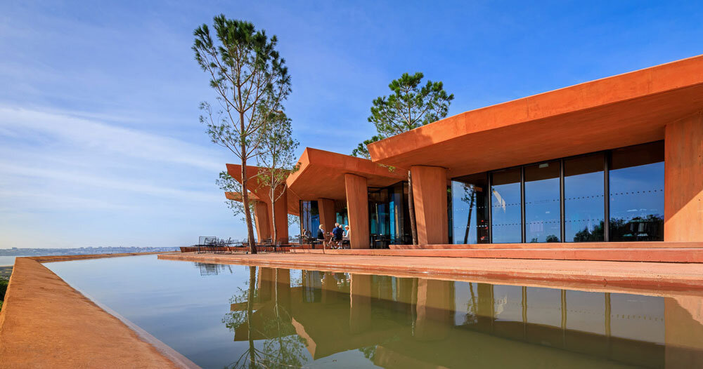 RCR arquitectes sculpts palmares clubhouse with plates of red concrete