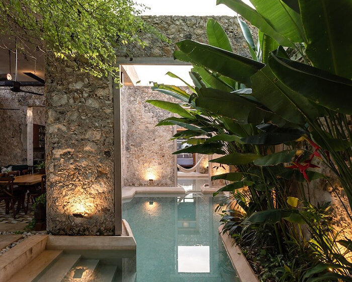 old factory turned residence becomes an oasis within the city of mexico