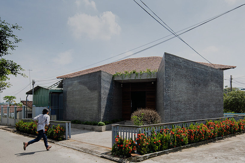 Solemn Shadowplay Exposed Roofing Highlight Lacquerware Pieces In Vietnamese Showroom By Hinzstudio