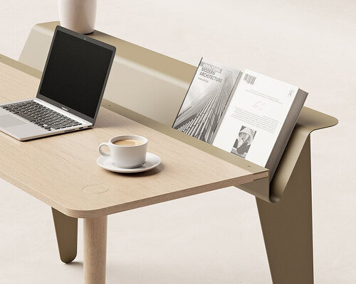 the piano desk features a metal stand that holds books like sheets of music