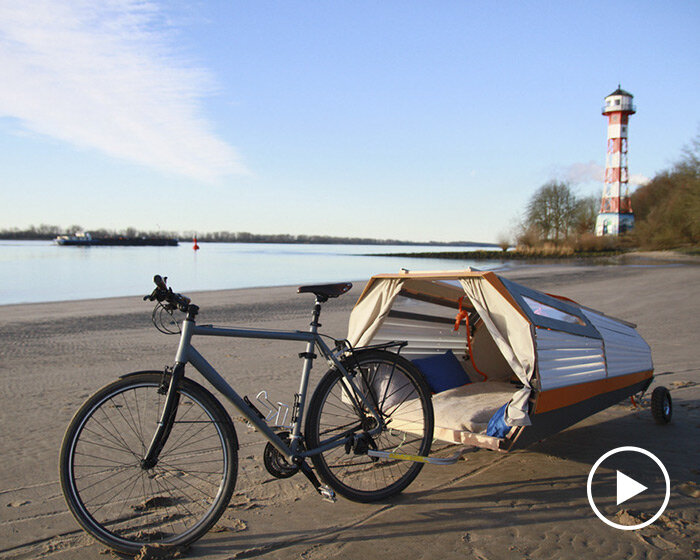 this portable treehouse trailer can be towed on a bike to provide shelter anywhere