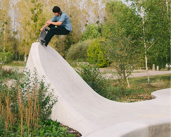 wavy concrete strips stretch along french industrial site to form 'skatepark continua'