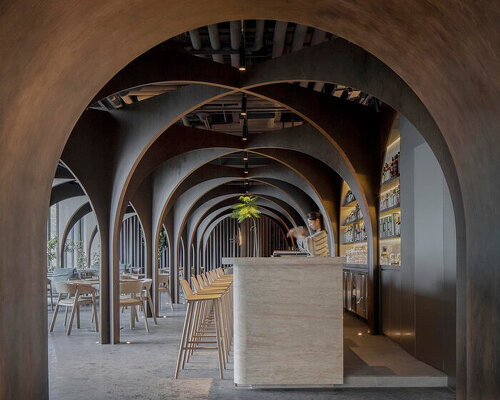 a matrix of cross arches stimulates curiosity within MARS studio's restaurant in china