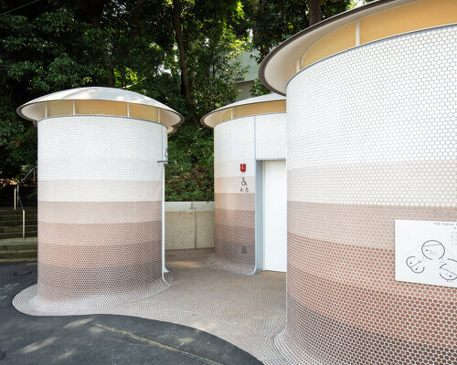 toyo ito's tokyo toilet appears like three mushrooms sprouted in the woods