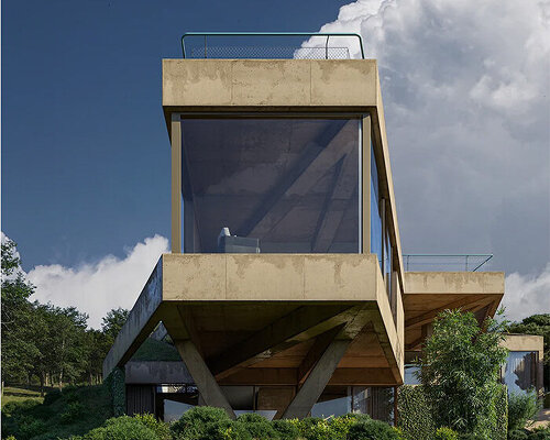 triangular configurations and brutalist aesthetics characterize concrete residence in georgia