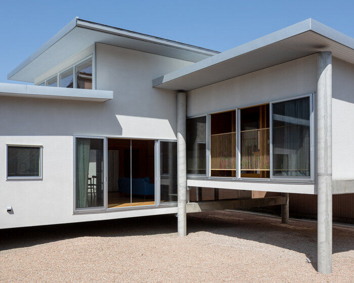 UNEMORI ARCHITECTS elevates flood-proof house on stilts in takaoka, japan