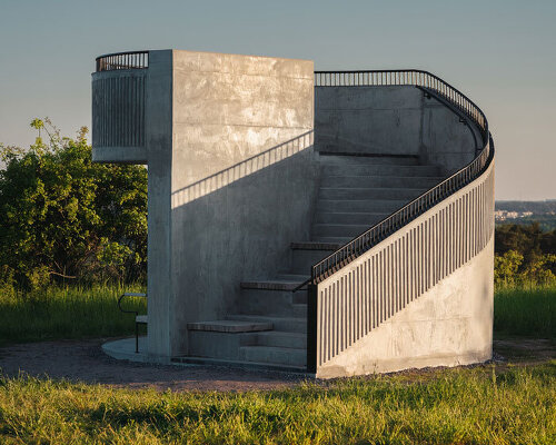 andrénfogelström's viewing tower appears as a monolithic object in the landscape of sweden