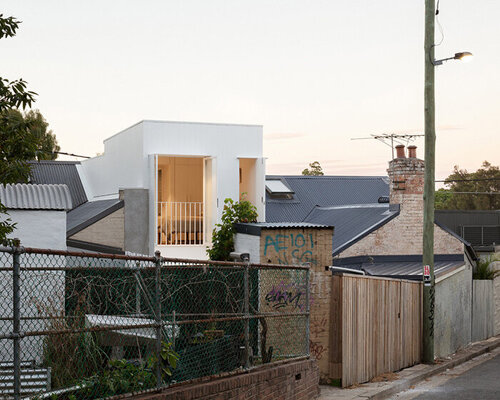 micro home nestled among busy surroundings in sydney is lightweight and simple in form