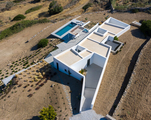 react architects embeds 'the nest' house into the natural landscape of paros, greece