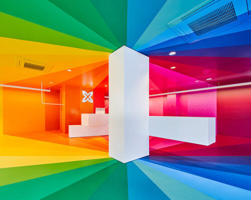 a color explosion: studio animal completes rainbow-hued store in barcelona