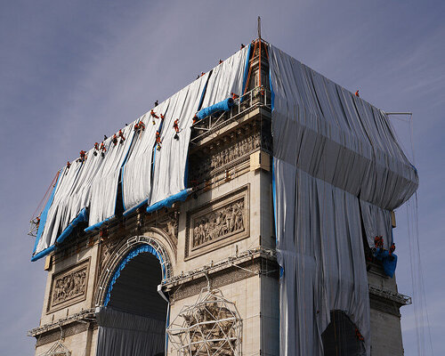 christo wraps paris’ arc de triomphe in recyclable silvery blue fabric